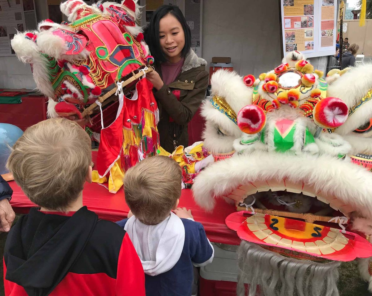 Children meeting lion dancers at the festival